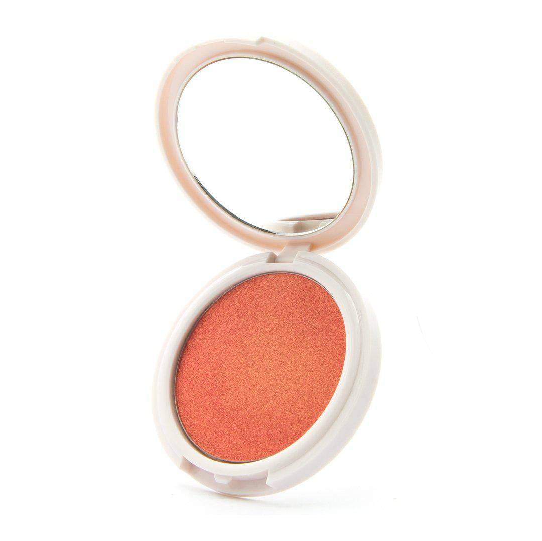Just Peachy - Peach highlighter with gold undertones Coloured Raine Cosmetics. In a mirrored, circular container.