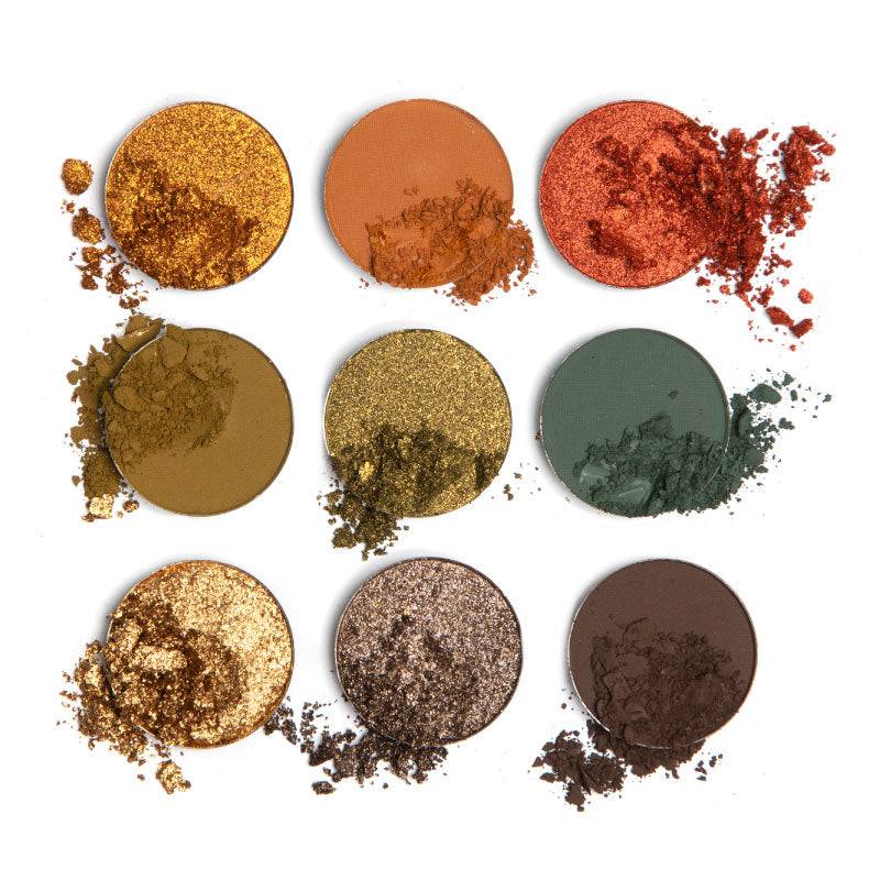 9 pan earth-toned eyeshadow palette single pans disrupted so the viewer can see the texture.