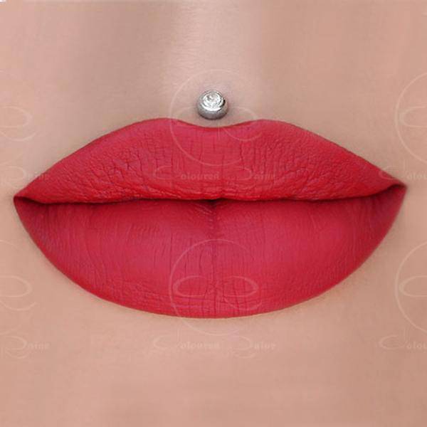 Vanity Raine red liquid lipstick with orange undertones by Coloured Raine Cosmetics