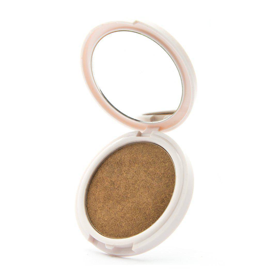 Your Treat - Golden bronze highlighter by Coloured Raine Cosmetics. Open, in a white, circular, mirrored container.